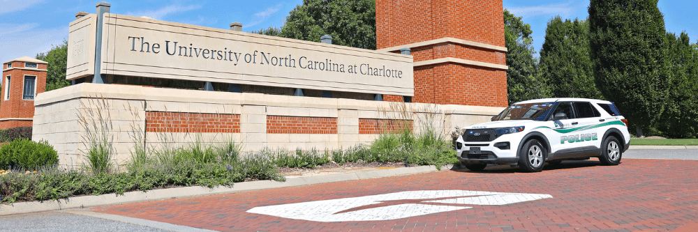 PPS car in front of UNC Charlotte sign